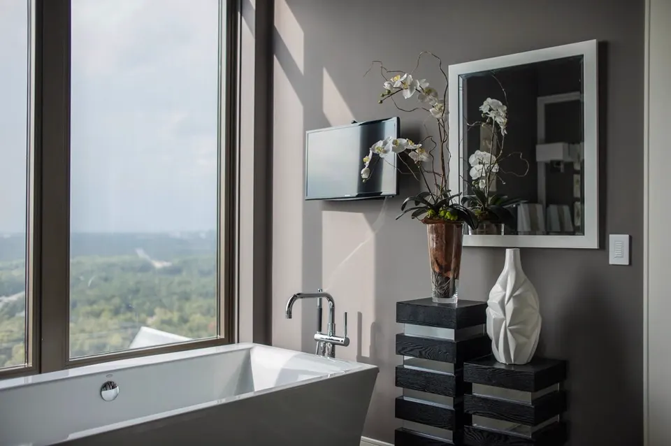 Contemporary bathroom with soaking tub and window view