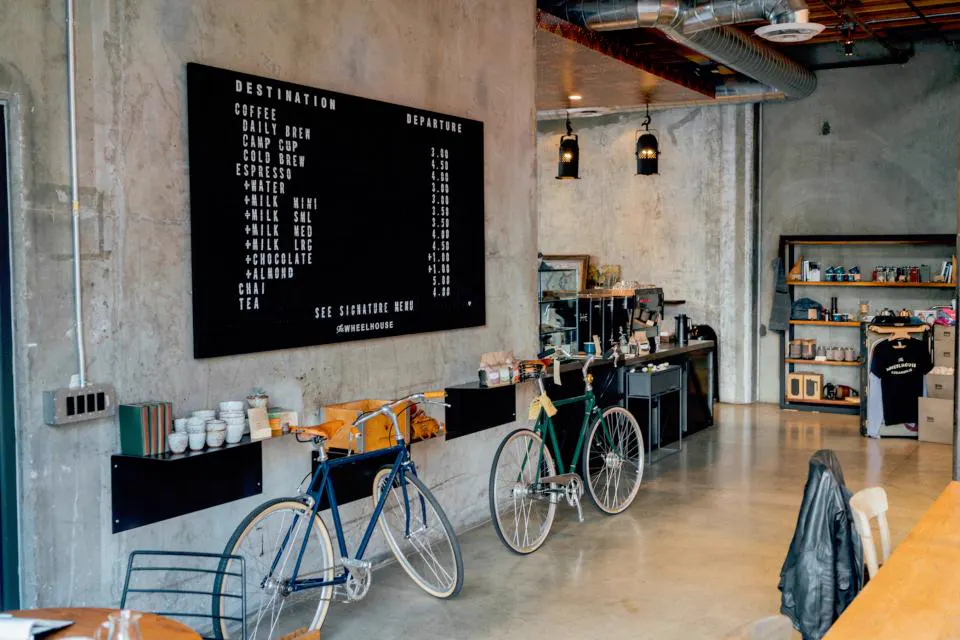 Industrial cafe interior with concrete and menu board