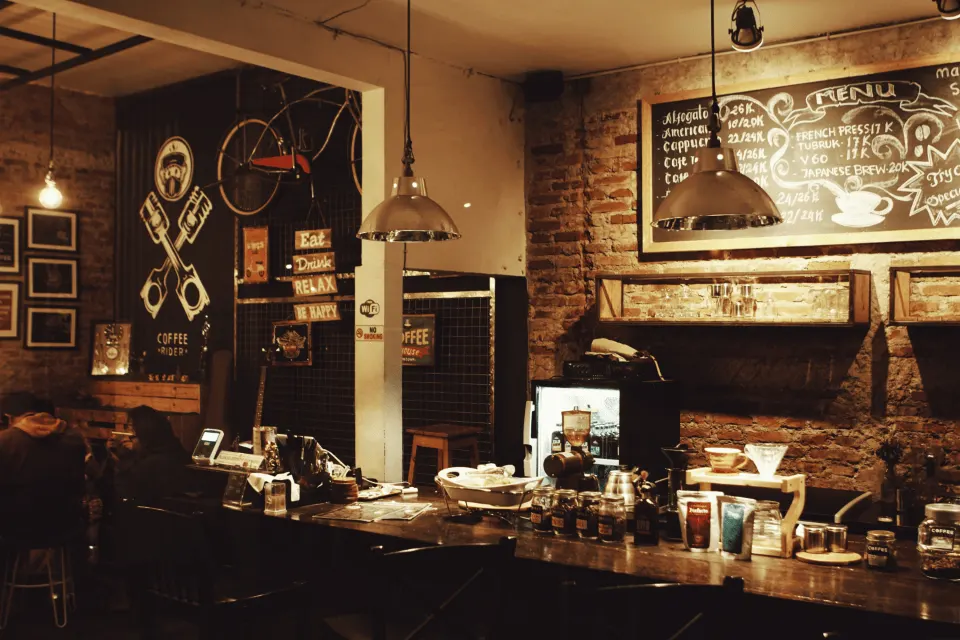 Cafe interior with pendant lights and chalkboard wall
