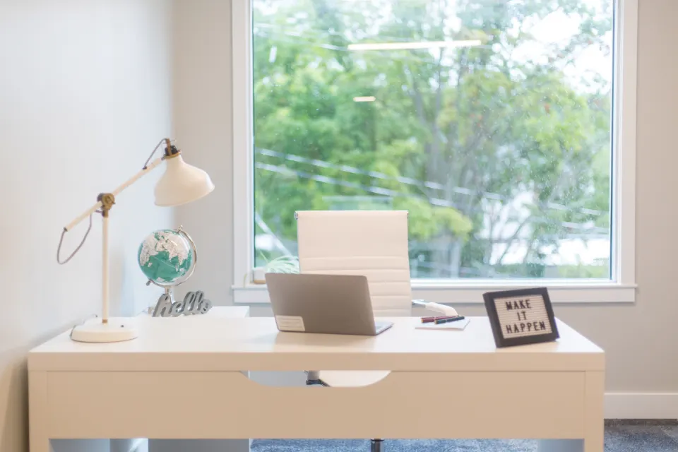Bright home office desk with task lamp