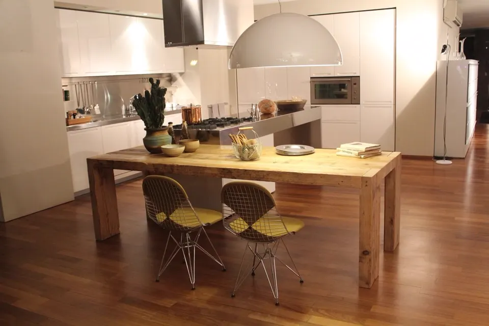 Kitchen and dining with solid wood table and dome pendant lamp