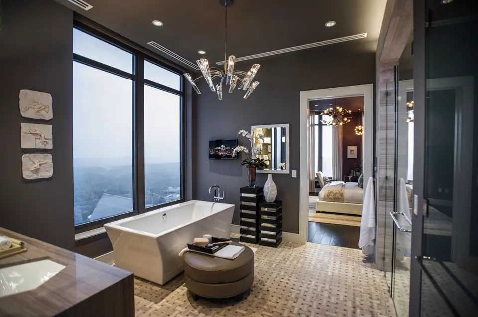 Luxury bathroom with freestanding bathtub and chandelier