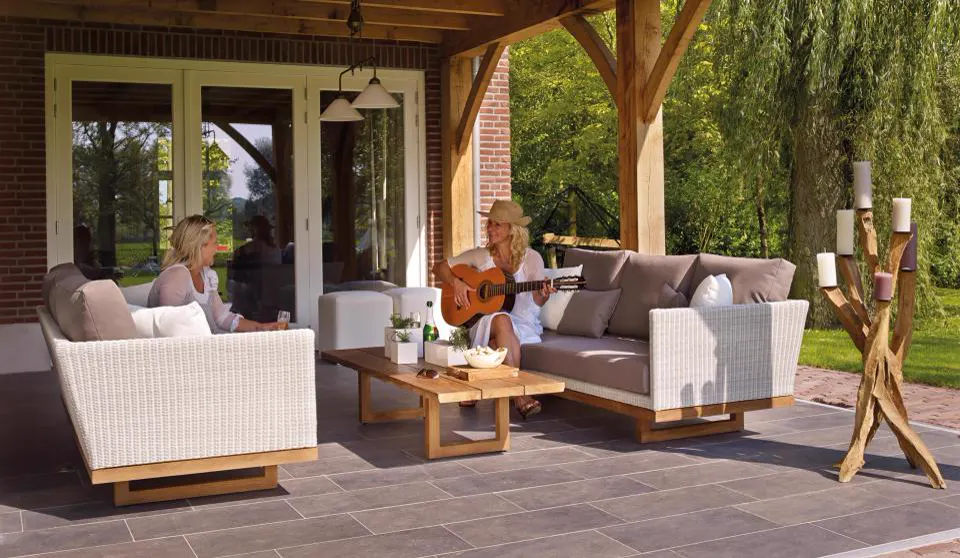 Outdoor patio lounge with sofa seating and pergola
