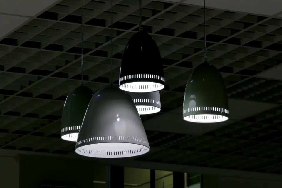 Row of pendant lamps in a dark interior