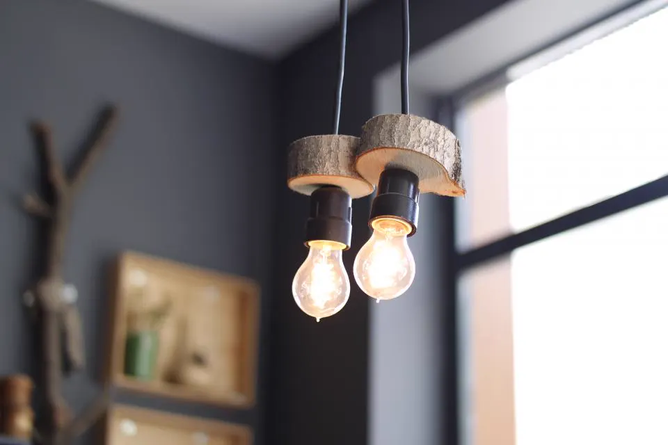 Wooden pendant lights with exposed bulbs