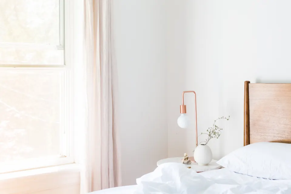 Serene white bedroom with soft linen and minimal decor